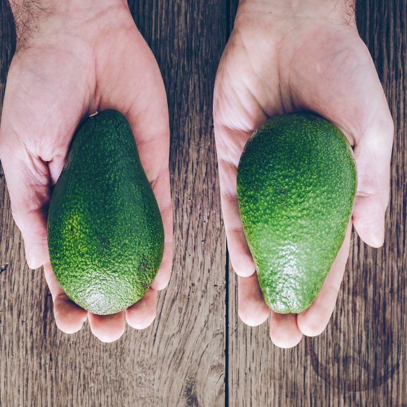 Person with avocado in each hand