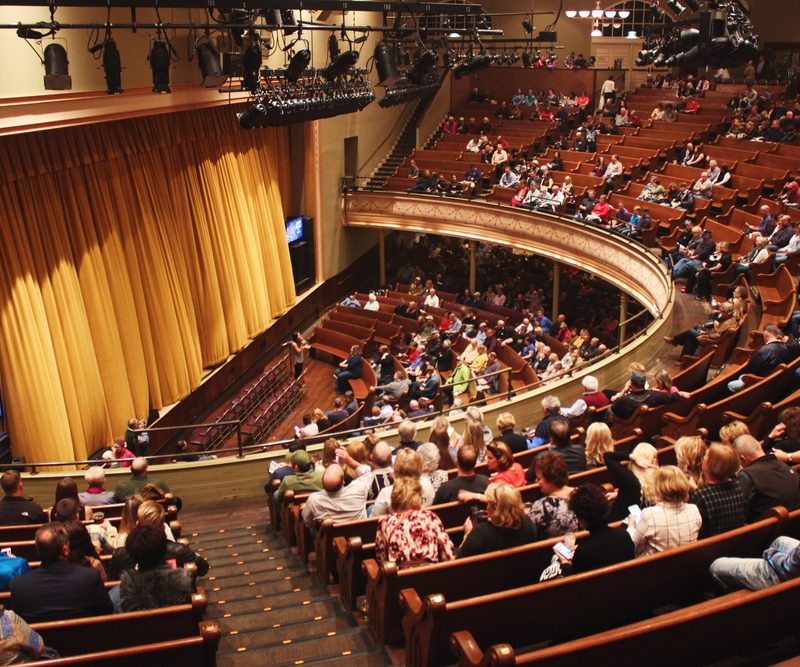 The audience anticipating a live performance at the Ryman Auditorium.
