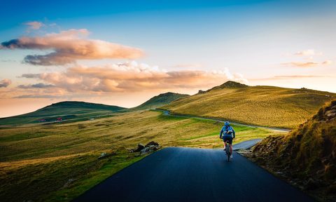 Man cycling on paved path