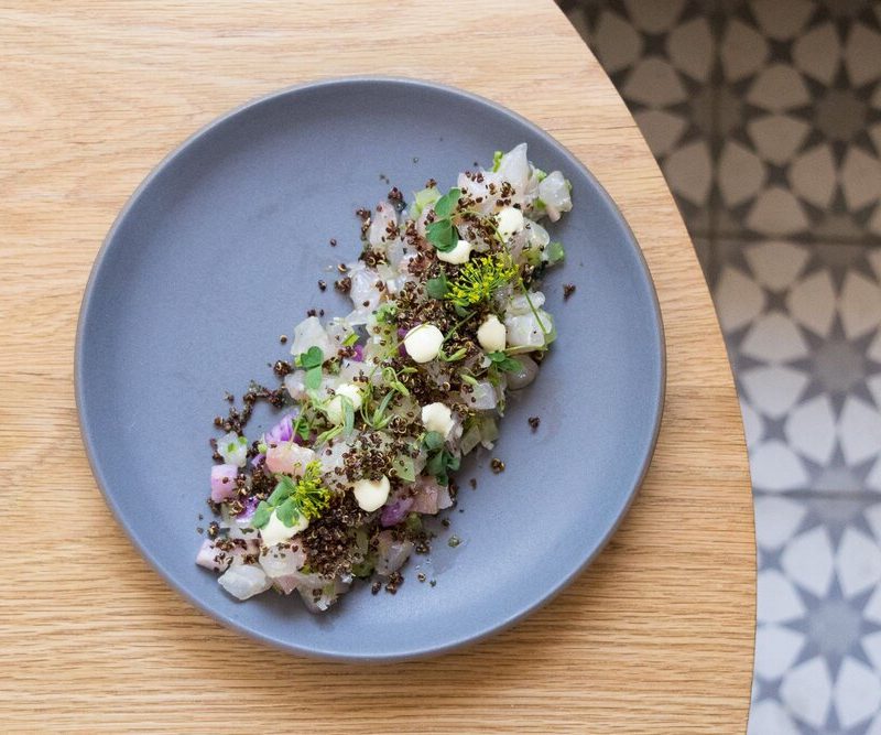 A dish served at a wooden table