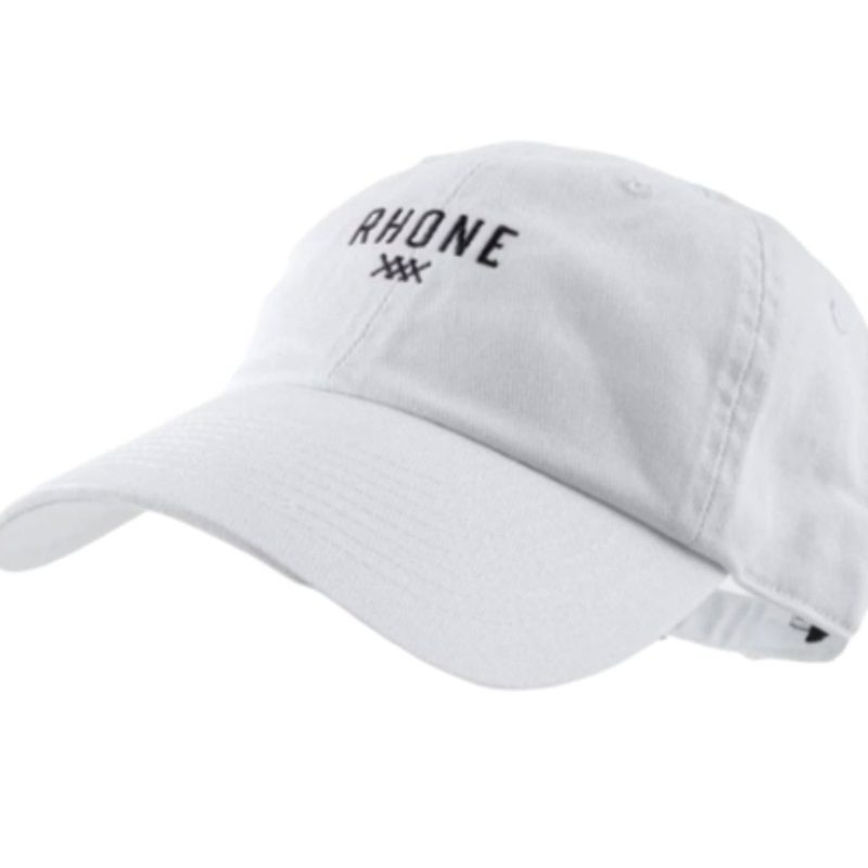 A white Rhone Dad Hat with an embroidered front logo.