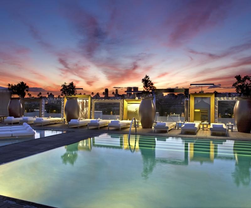 Pool area of SLS Hotel during sunset.