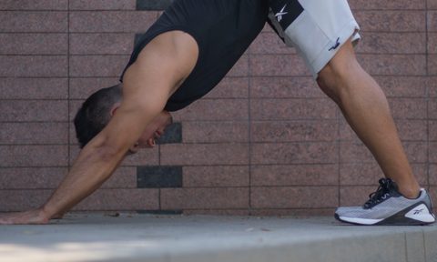 Man doing dowward dog pose