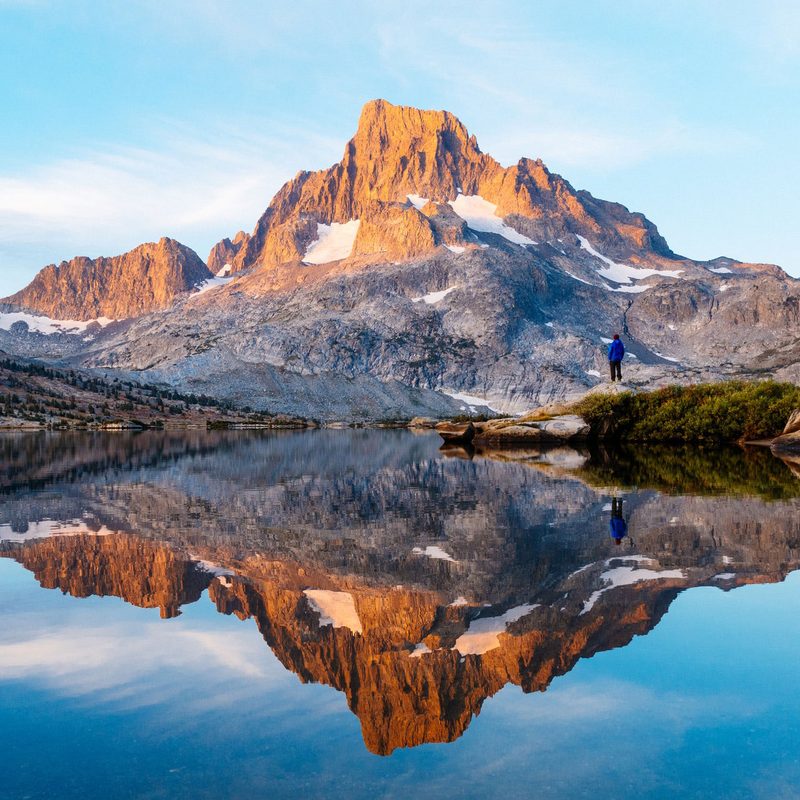Hiker looking out on Thousand Island Lake along California's John Muir Trail