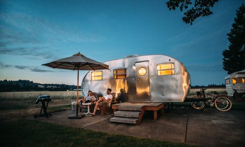 Couple outside an RV during a road trip
