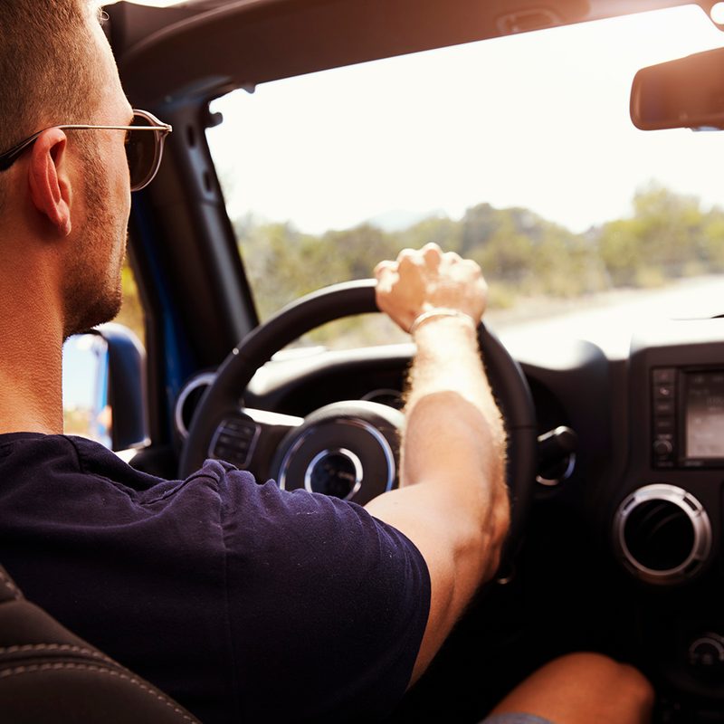 Man driving on country road