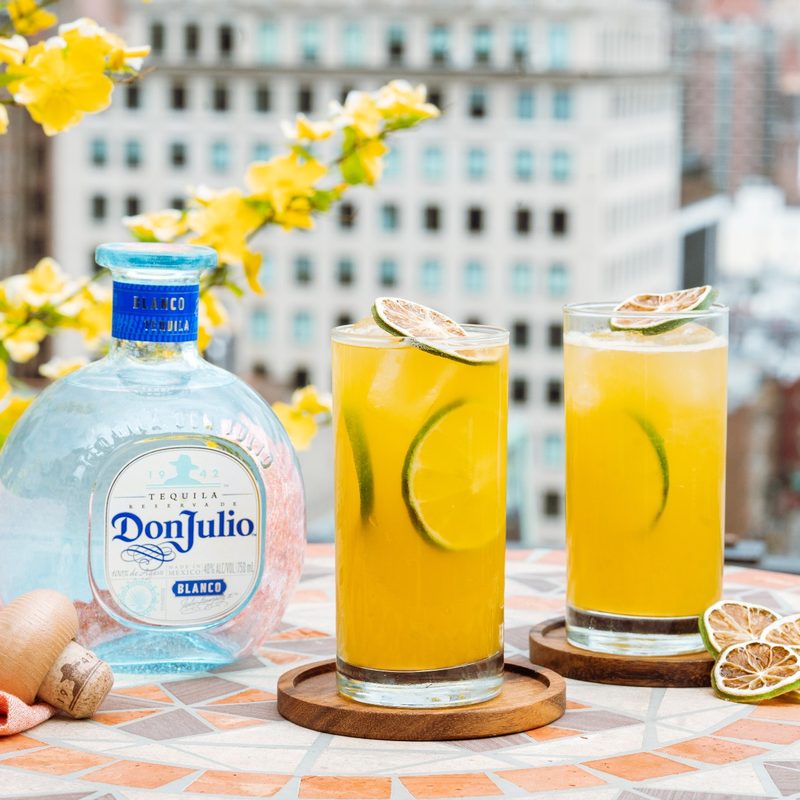 A Passion for Tequila Cocktail in glasses and a bottle of Don Julio by the side.