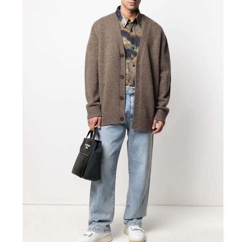 Acne Studios Loose Fit Jeans with polo shirt, a cardigan, a handbag, and sneakers.