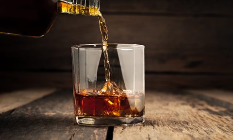 Pouring a glass of whiskey