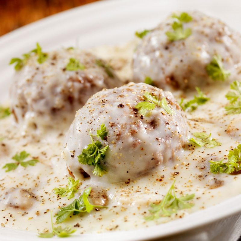 Meatballs in a mushroom béchamel sauce with fresh parsley