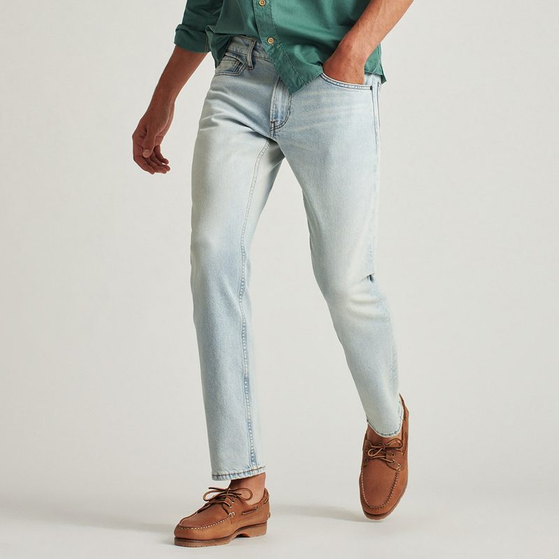 Bonobos All Season Jeans paired with green polo and khaki leather shoes.