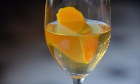 Champagne cocktail with a lemon twist