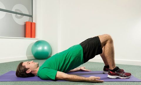 A man doing glute bridges