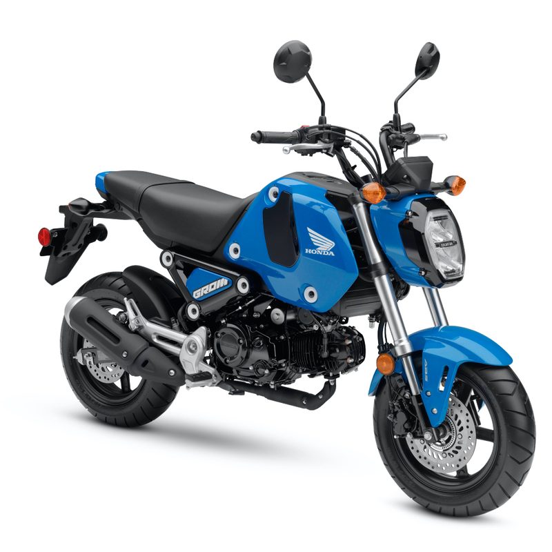 Front side profile view of the Honda Grom motorcycle against a white studio backdrop