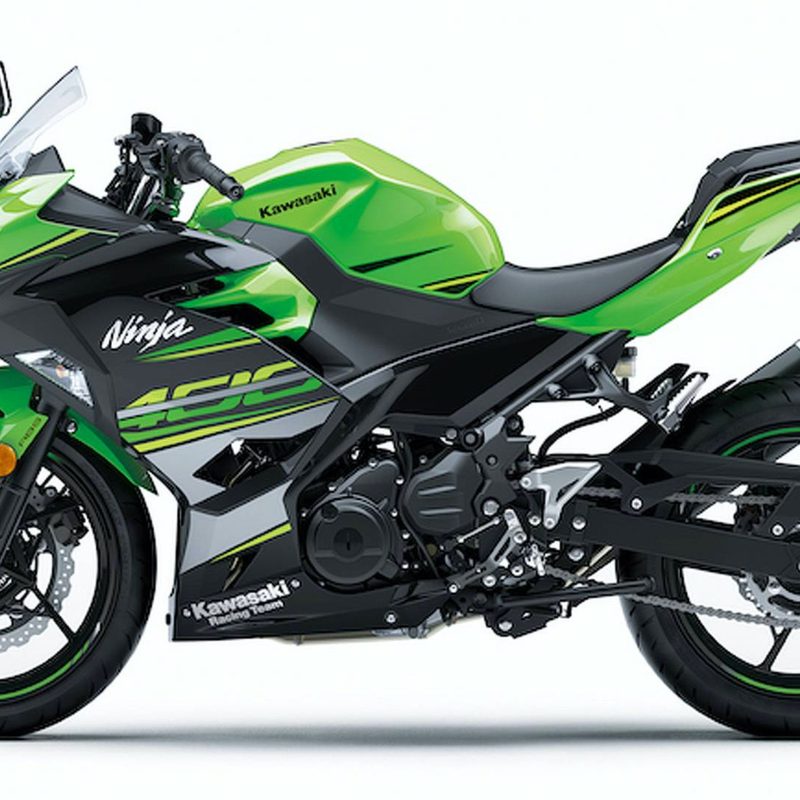 Side profile of a green Kawasaki Ninja 400 motorcycle against a plain white backdrop