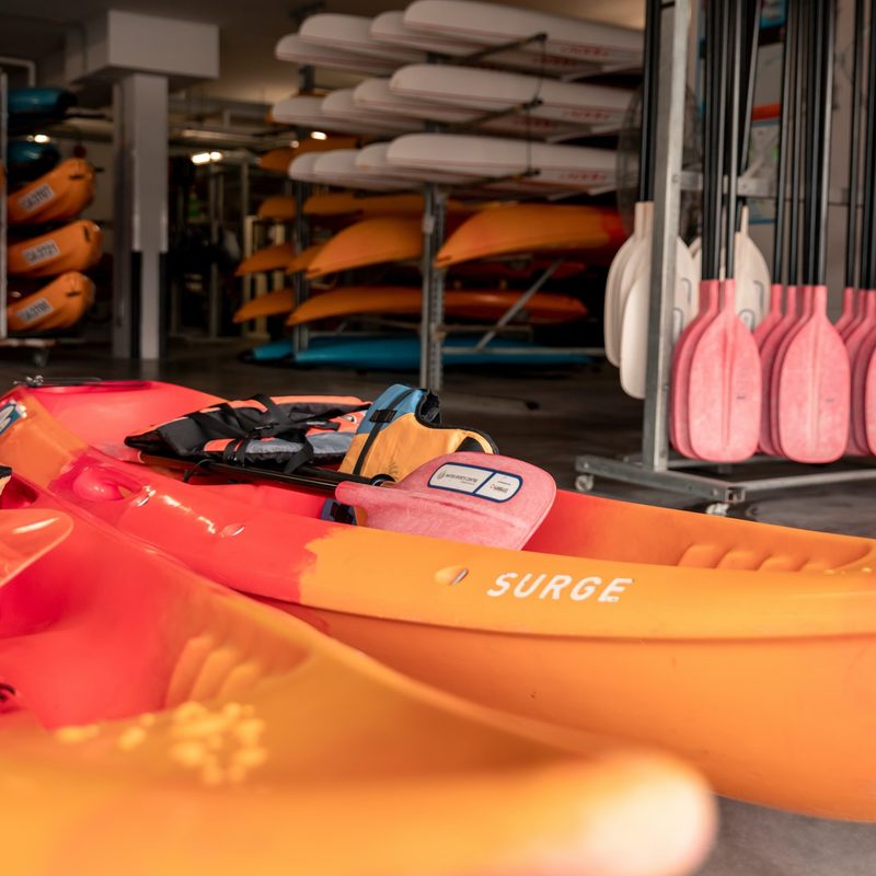 Two orange-and-red kayaks