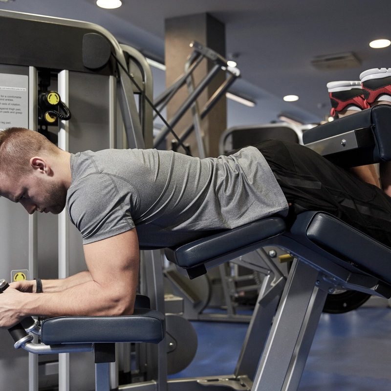 Man doing leg curls