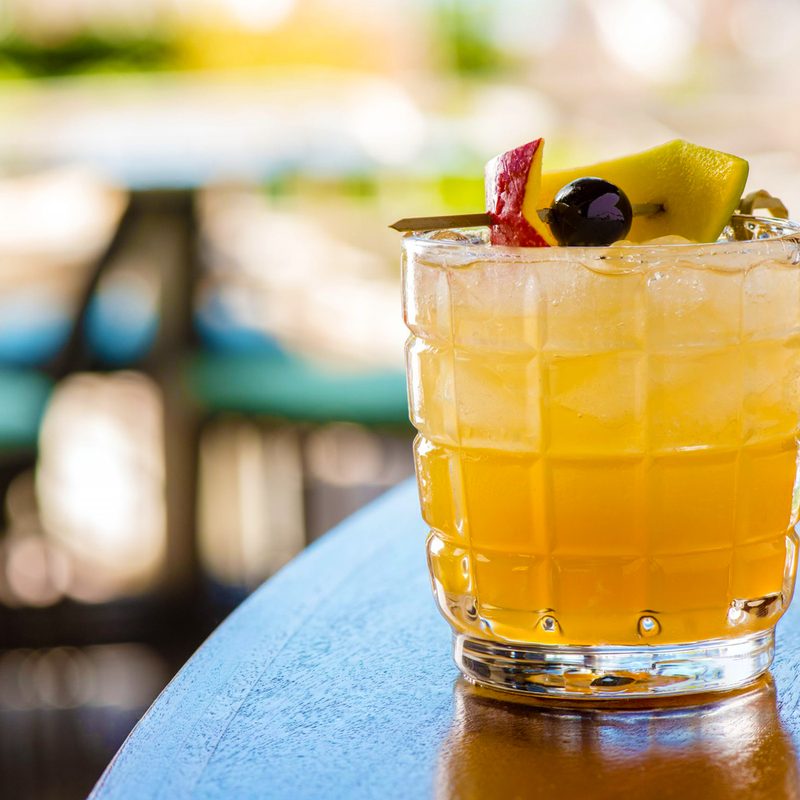 A refreshing glass of Miami Godfather on a table.