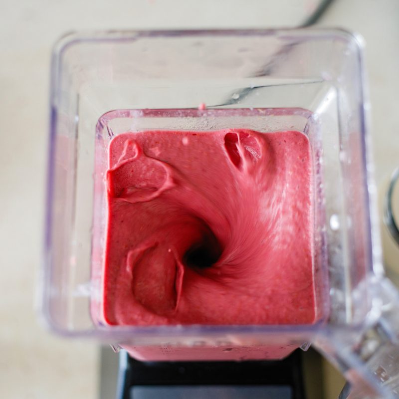 Preparing a strawberry milkshake