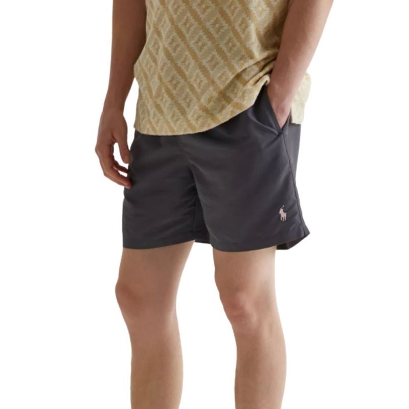 Model wearing the Polo Ralph Lauren Swim Shorts in black in front of a white background.
