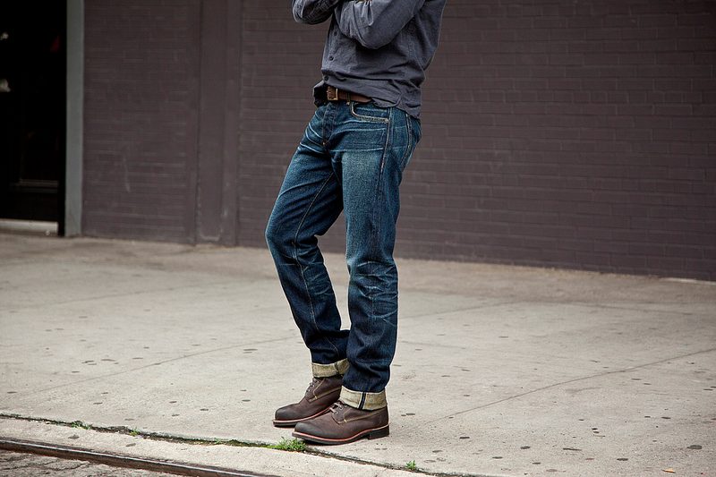 Man wearing jeans and boots.
