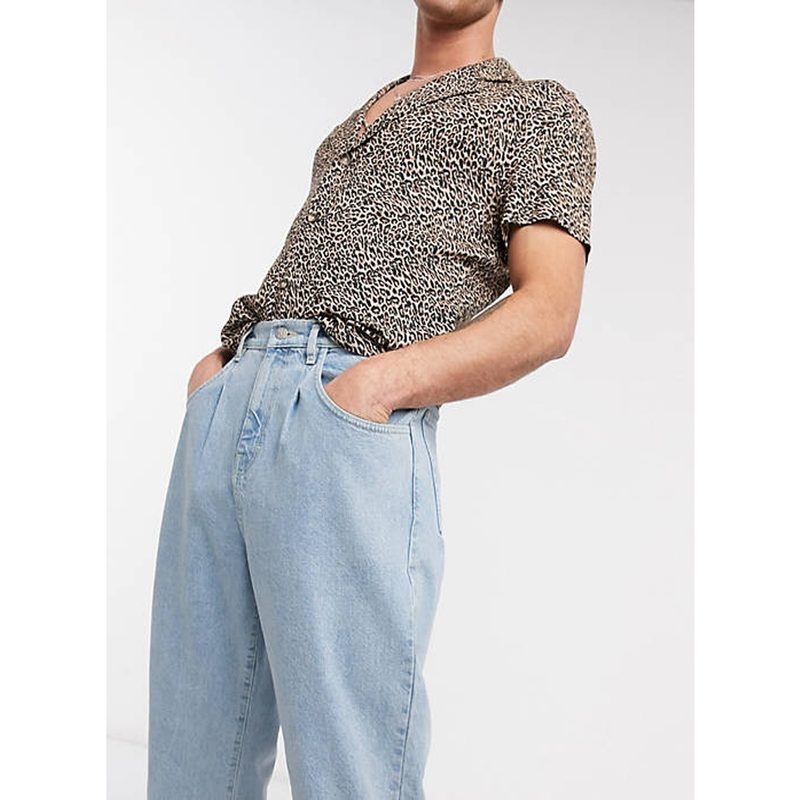 Reclaimed Vintage Inspired the '83 Relaxed Jeans paired with animal print shirt.