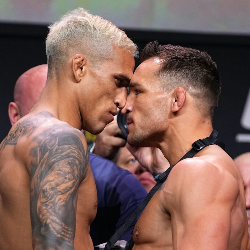 Charles Oliveira and Michael Chandler facing off at a press event for UFC 262.