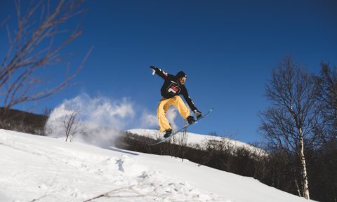 Snowboarder mid-flight