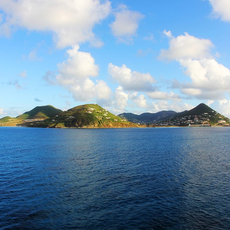 Green peaks of the Virgin Islands, seen from the water.