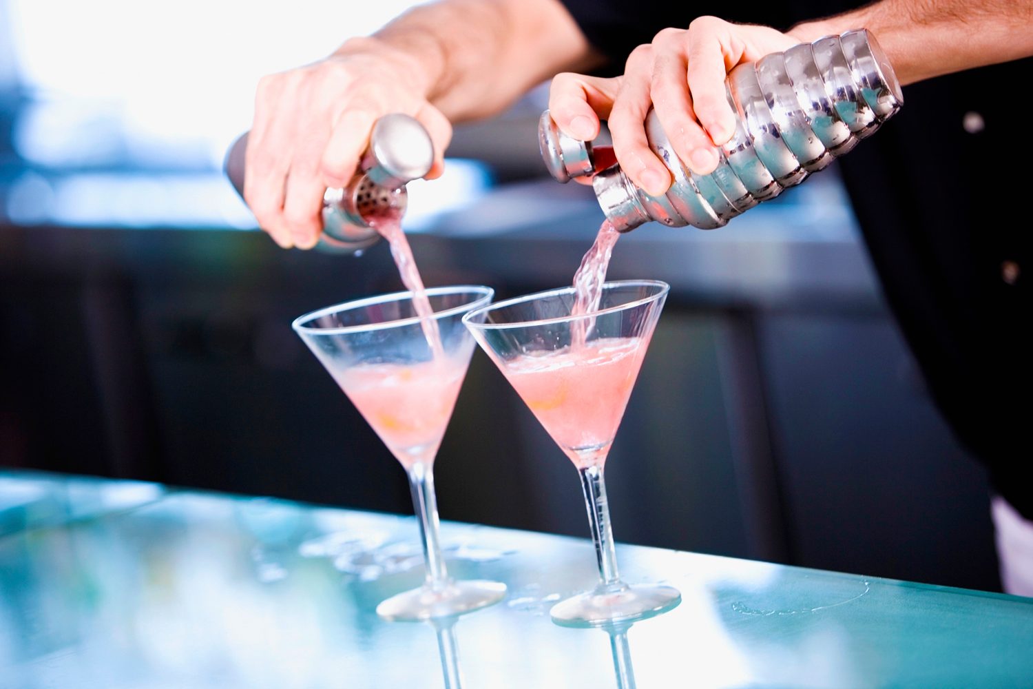 Bartender making vodka martinis