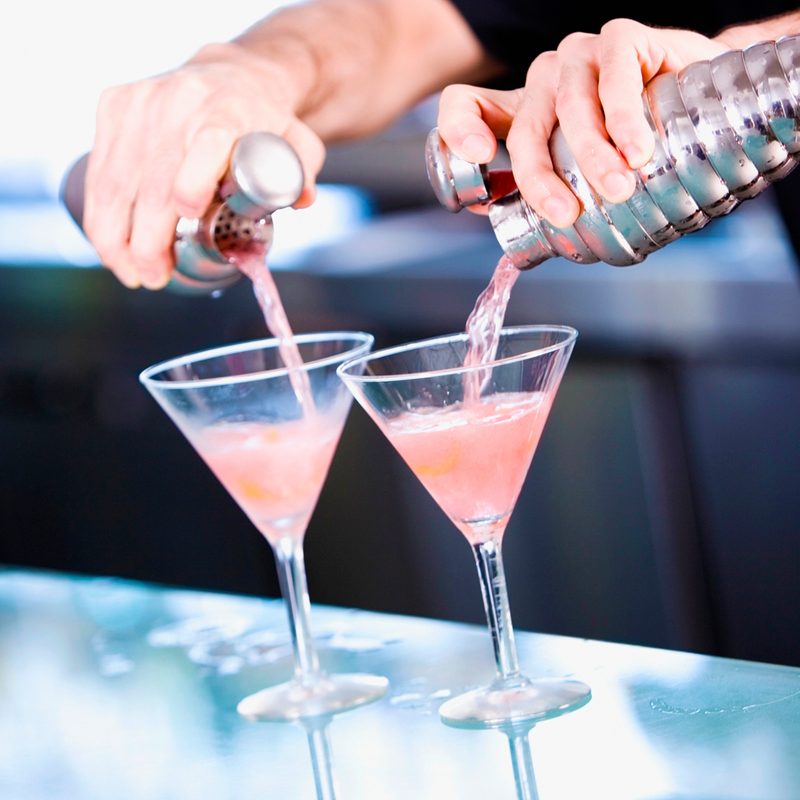 Bartender making vodka martinis