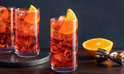Refreshing vold Americano cocktail with an orange garnish