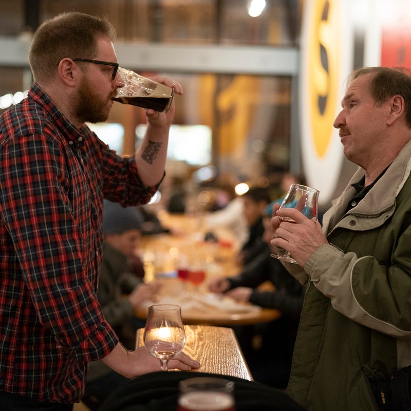 Two men having a drink together.