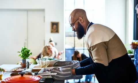 A man cooking in the kitchen.