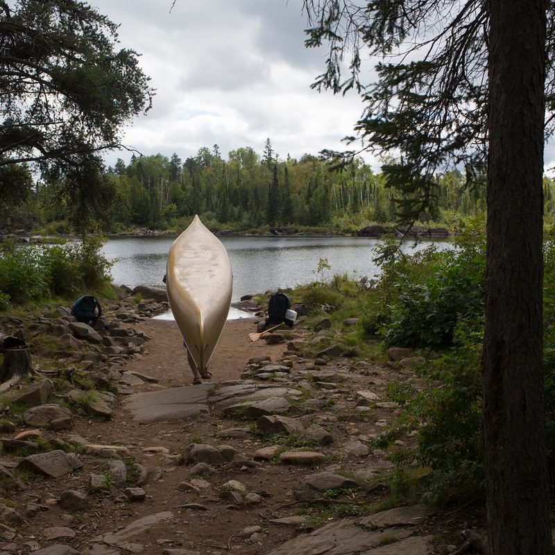 Man carrying canoe.