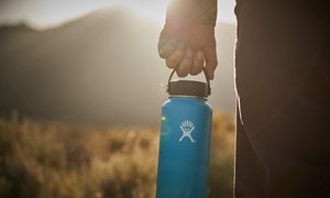 A person holding a Hydro Flask.