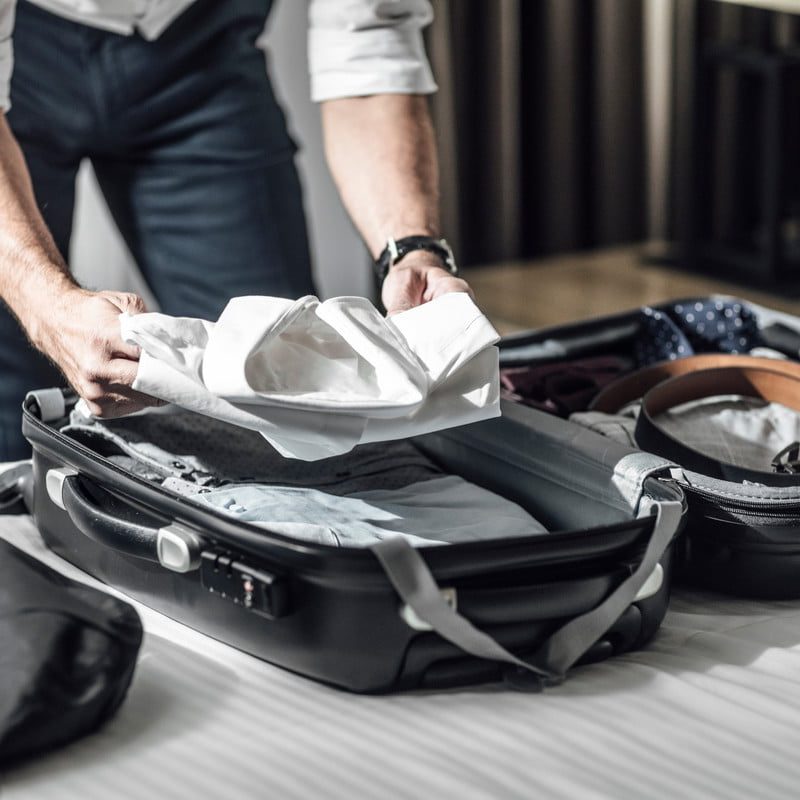 Man packing a suitcsase