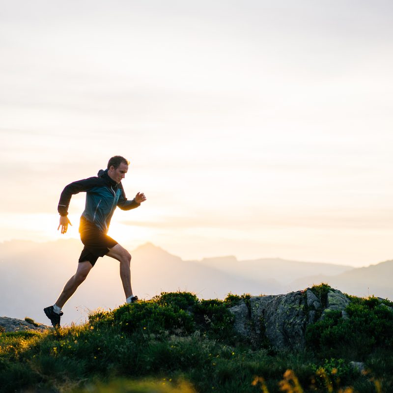 Man running on mountain.