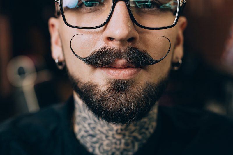 Man with a handlebar mustache.