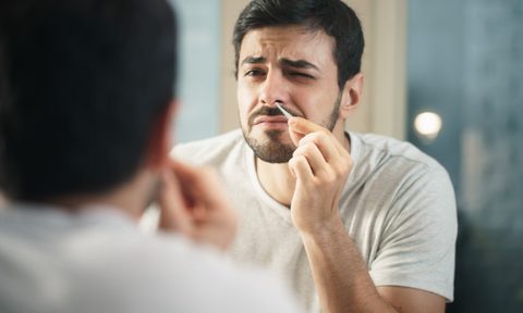 best nose hair trimmers handsome man trimming in bathroom