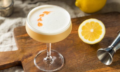 Homemade Boozy pIsco sour cocktail with bitters