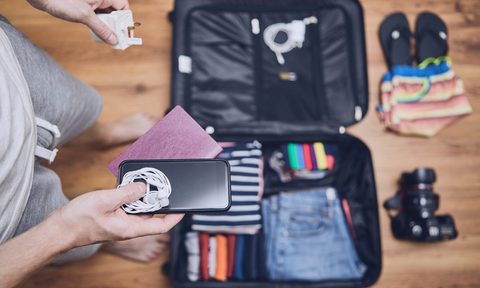 Someone packing their suitcase for a trip.