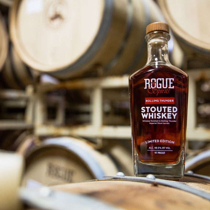 A bottle of Rogue Spirits Rolling Thunder Stouted Whiskey.