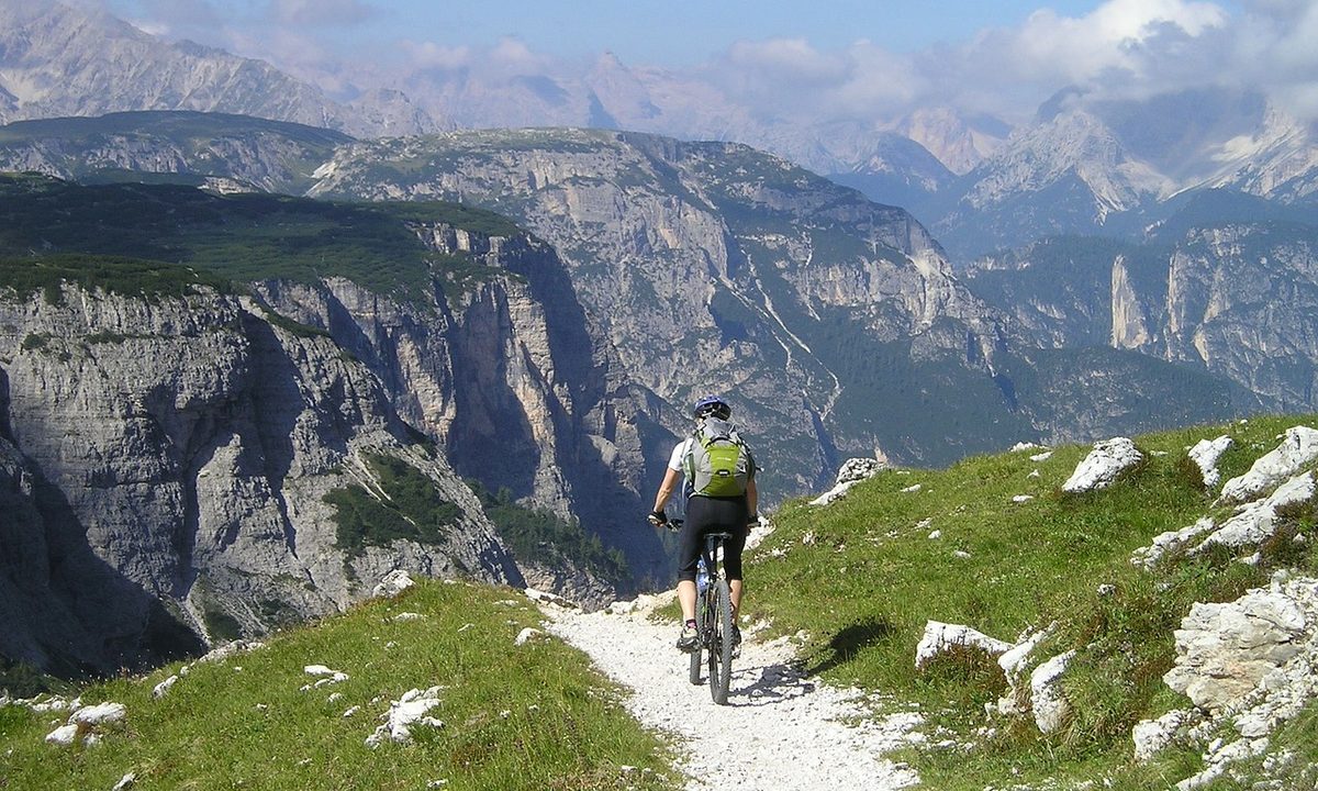 Person bicycling on a single track