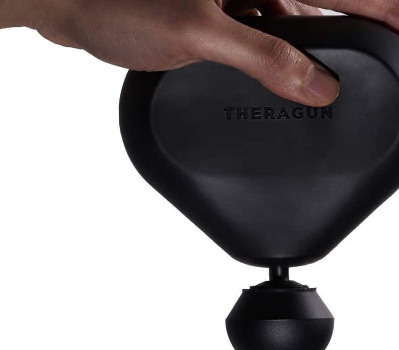 Theragun Mini over a white background.