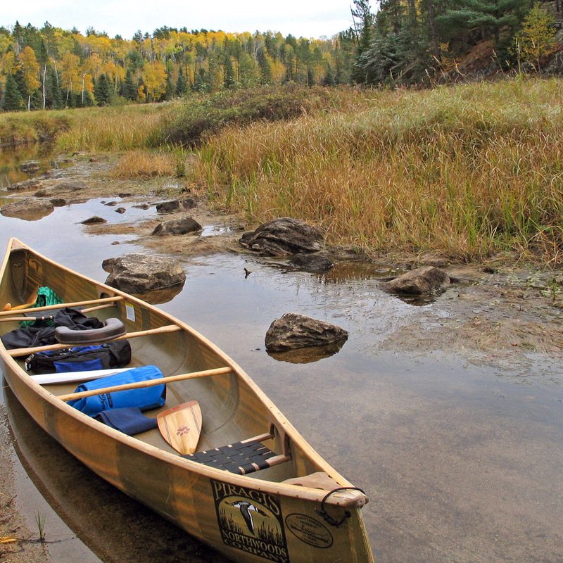 Canoe in shallow water.