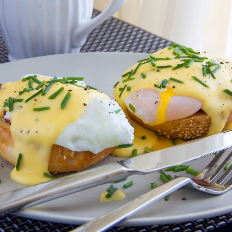 Eggs Benedict. toasted muffins, ham, poached eggs, and delicious buttery hollandaise sauce