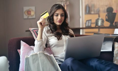 unique subscription boxes woman sitting with credit card