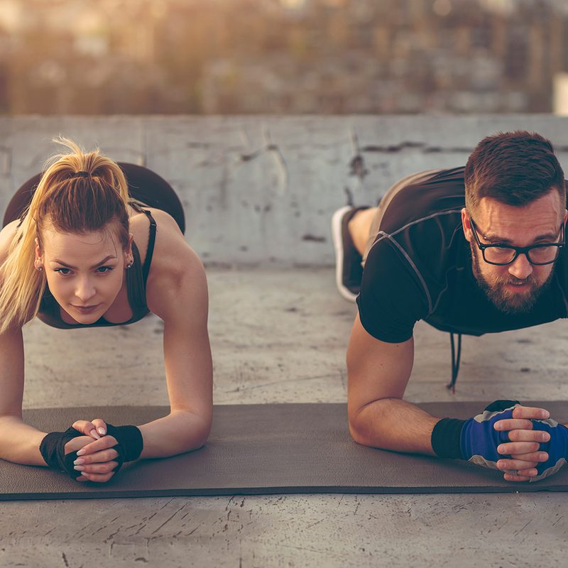 Couple doing a plank exercise