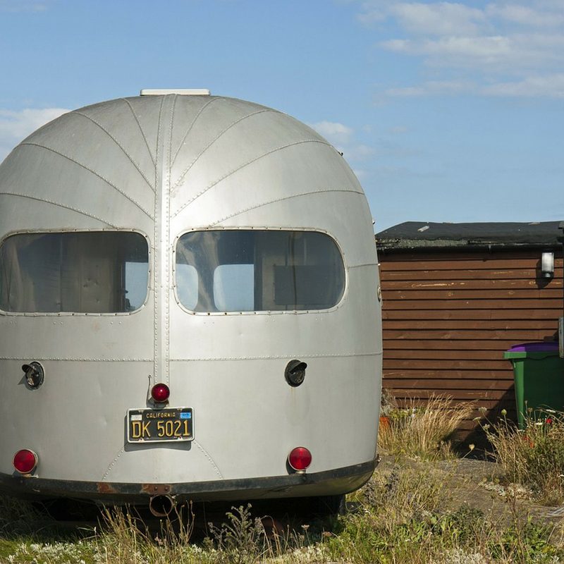 An airstream trailer on the field.